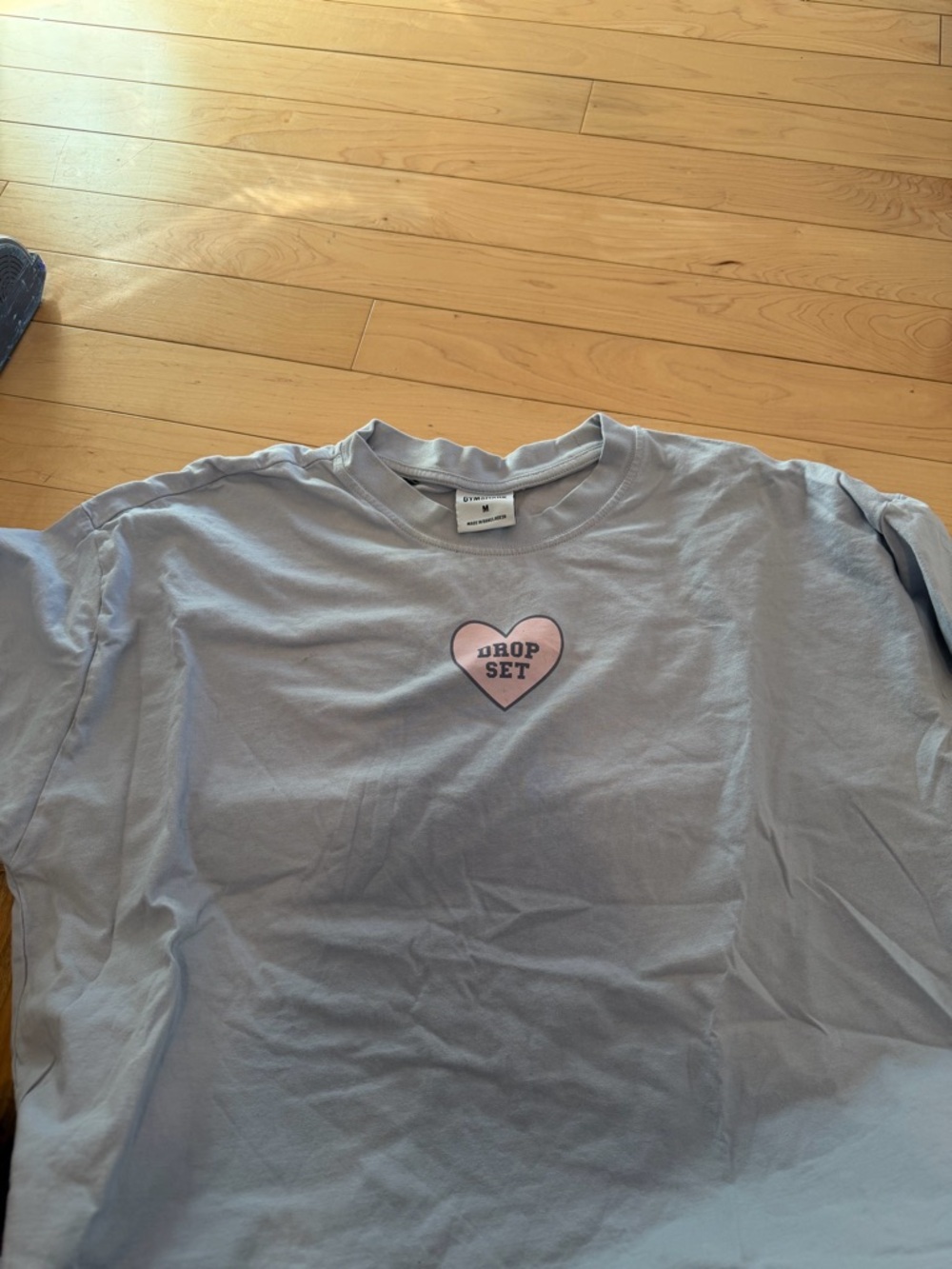 Gymshark Light Blue Tee with Pink Heart Graphic